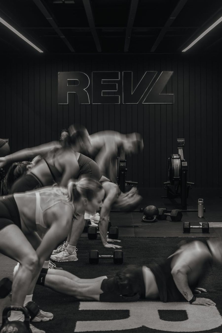 Group working with dumbbells